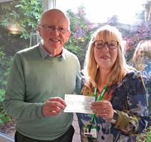 President Ray Jefferson giving a cheque to Macmillan Nurses